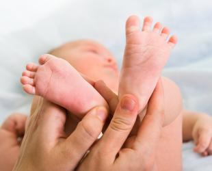 Massaging baby feet