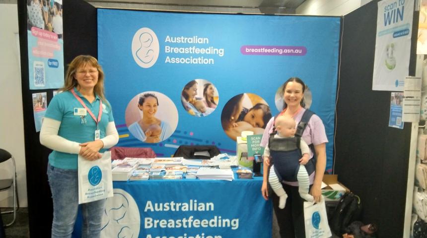 Two volunteers at a baby expo stand