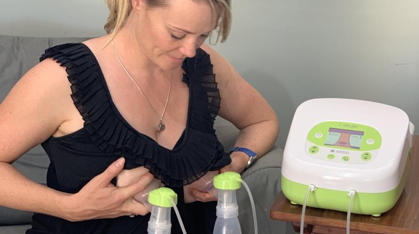 woman using a double breast pump
