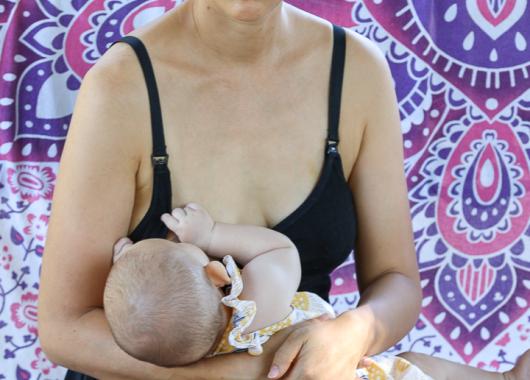 mum breastfeeding purple background.jpg
