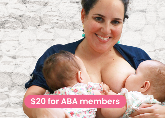 Woman breastfeeding twin babies