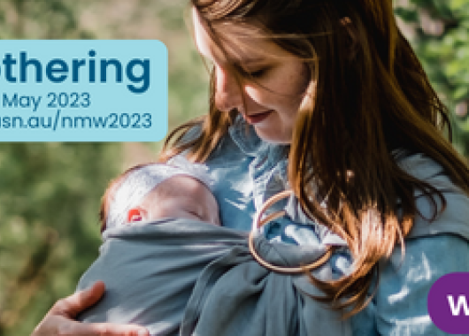 A banner image of a mum holding a sleeping baby in a carrier, with the text: 'National Mothering Week'