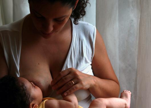 Mother and baby breastfeed
