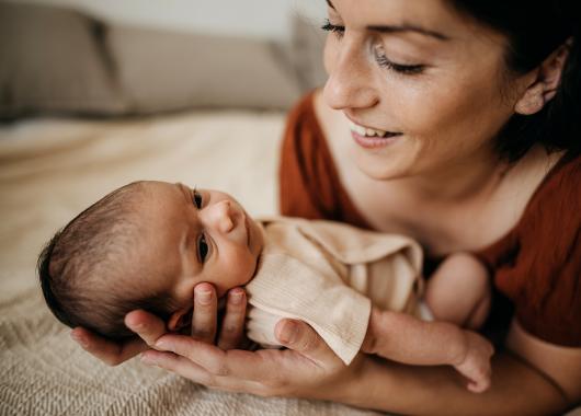 Woman holds newborn baby