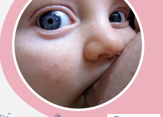 Photo of baby attached to the breast on a pink background with the ABA logo to the bottom right.
