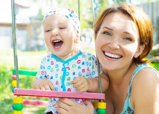 mother laughing with baby