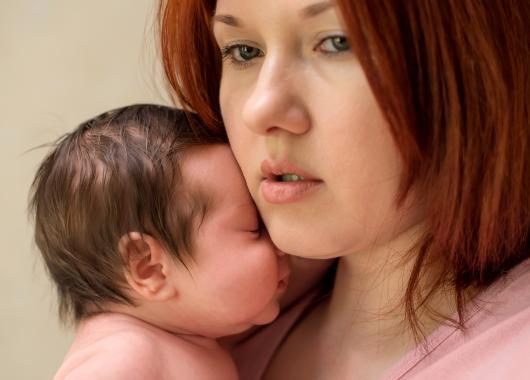 worried mum with baby