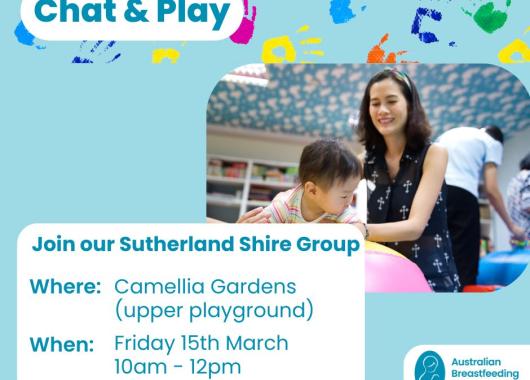 Lady helping a child on an exercise ball. 