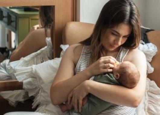 A mother holding her newborn