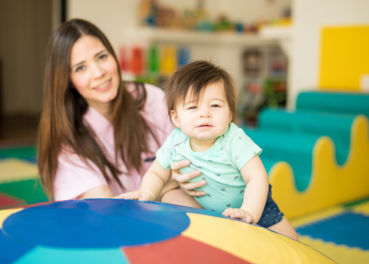 ECEC educator holding baby