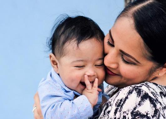 Mother and baby laughing