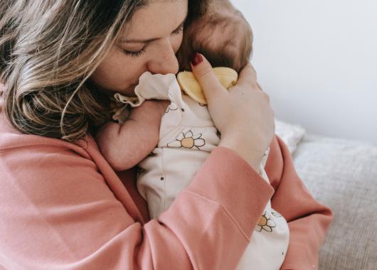 mother holding baby