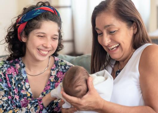 A woman with her baby and her mother