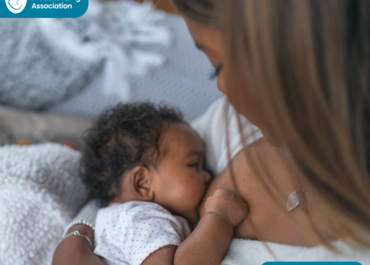 mother looking down at baby breastfeeding