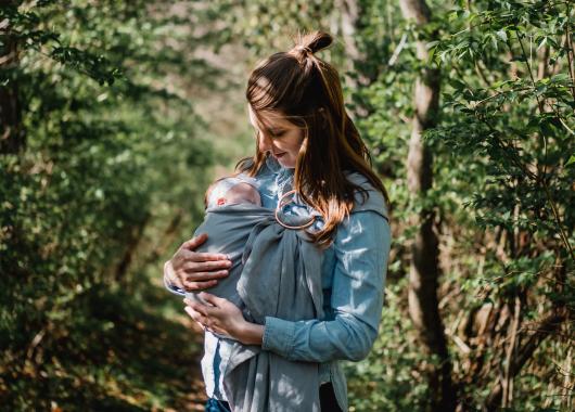 mum wearing baby in a sling