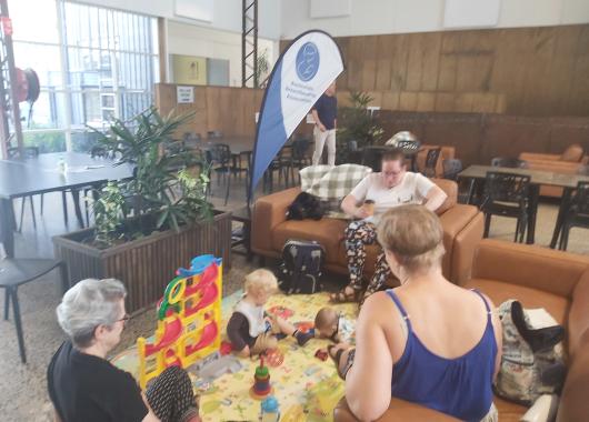 Meet of mums with babies playing on a mat