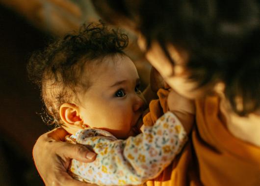Mother and baby breastfeeding