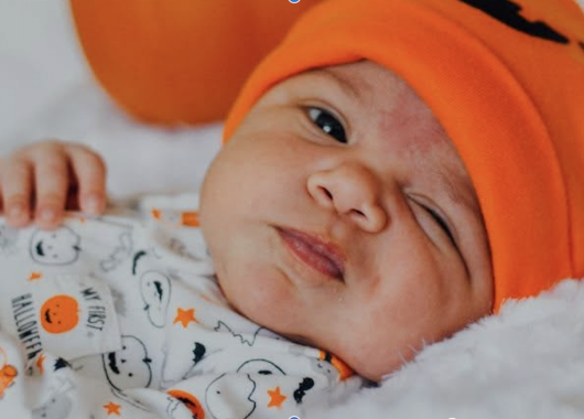 Baby in orange beanie