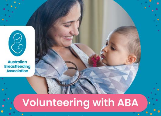 Teal background, mother with dark brown hair holding a baby in a sling. volunteering with ABA is written in white with a pink background. W