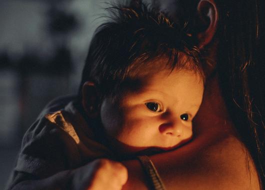 A mother and baby at night