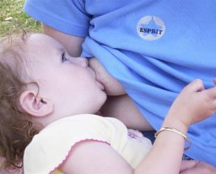 little girl breastfeeding
