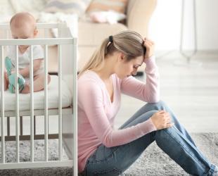 Mother sitting on floor