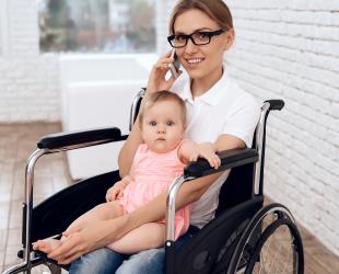 mother in wheelchair with baby