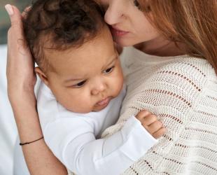 mum holding baby