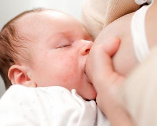 mother holding breast