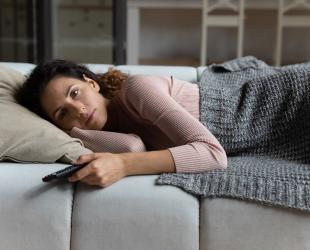 Woman lying on sofa