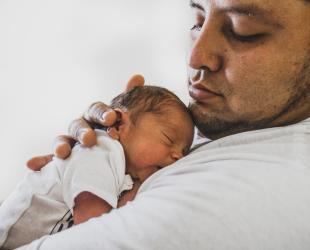 Father holding newborn