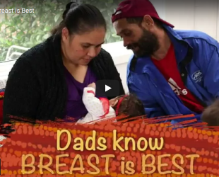 Aboriginal dad with mum breastfeeding
