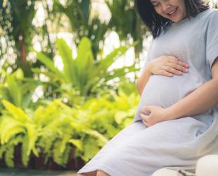 Pregnant woman smiles