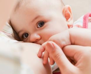 close up baby feeding