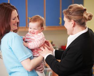 Mother dropping baby at childcare