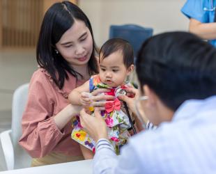 Mother and baby consult a health professional