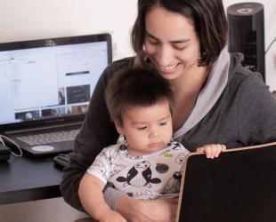 A group treasurer doing her volunteer work with her baby