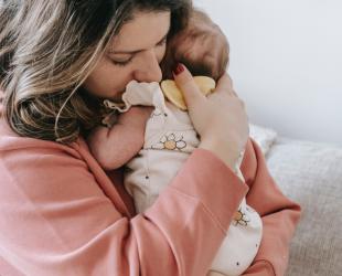 mother holding baby