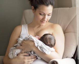 mother holding small baby
