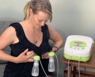 Woman using double breast pump