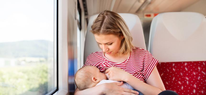 mum feeding on train