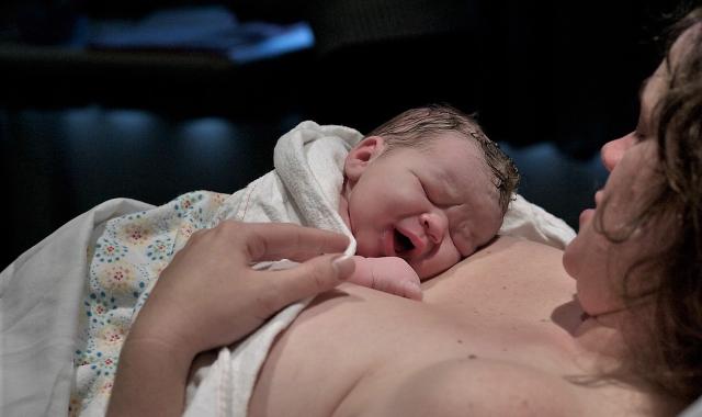 Baby on mother's chest