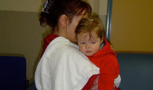 Holding baby with cloth on shoulder