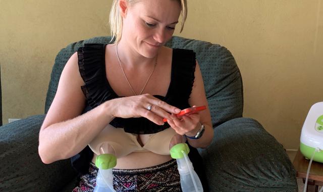 mum pumping with phone