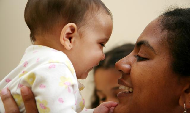 mother holding baby up