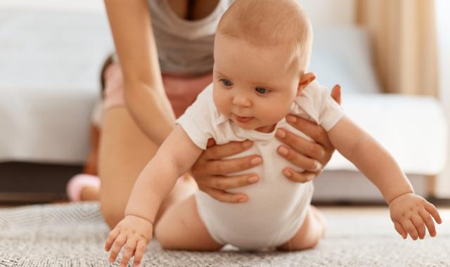 Baby playing on floor