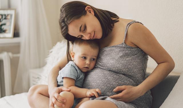 pregnant mum with baby