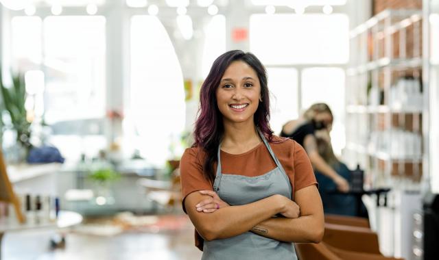 Smiling beauty salon owner