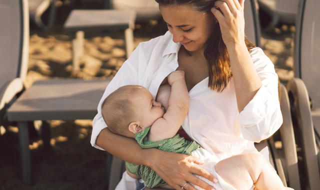 Mother and baby breastfeed