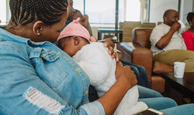 Breastfeeding mother sitting in coffee shop